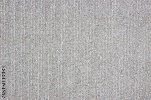 Light gray stone background with light vertical stripes.