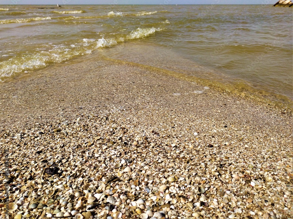 Rocky and sandy beach on sunset Rocky and sandy beach on sunset