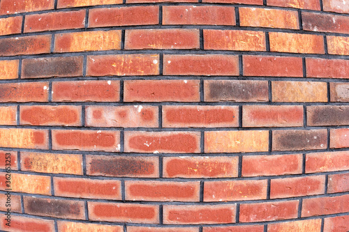 Red brick wall background. Old red brickwork texture. Fisheye lens view.