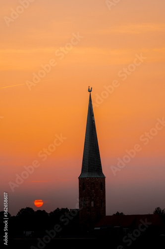 Skyline sunset with a silhouette of a historic church © Ricardo