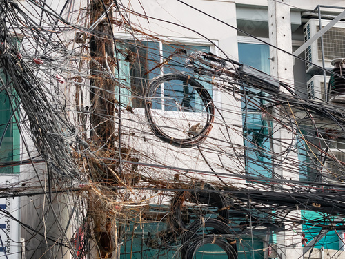 Photography messy chaos wires cables , telephone and internet fiber signal line on electric poles
