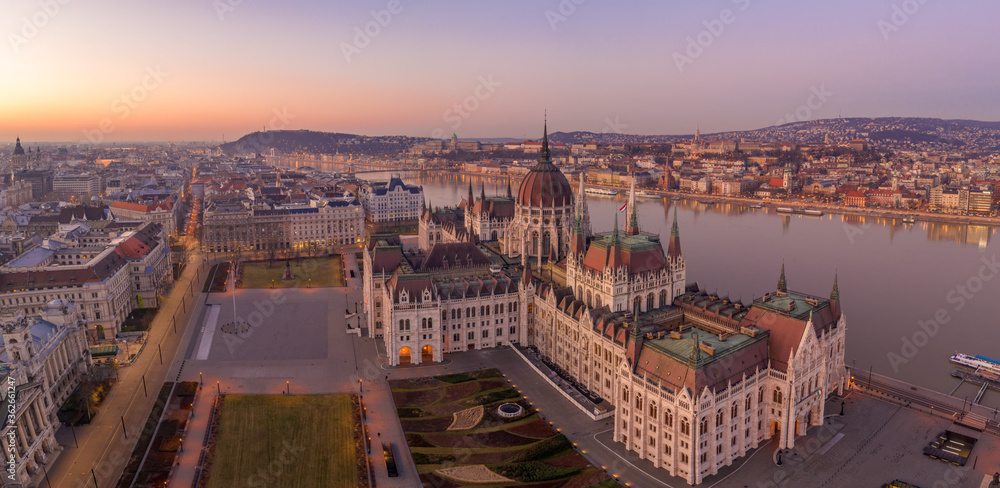 Fototapeta premium Panoramic aerial drone shot of Dome of Hungarian Parliament at dawn before sunrise in Budapest morning