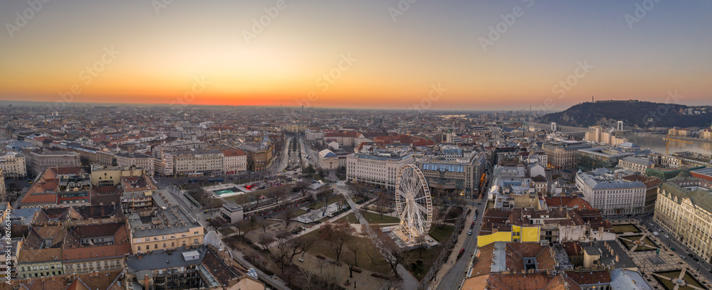 Panoramic Aerial drone shot of Jozsef Nador Square at dawn in Budapest downtown