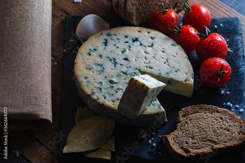 Fourme d'ambert cheese and bread with cherry tomato