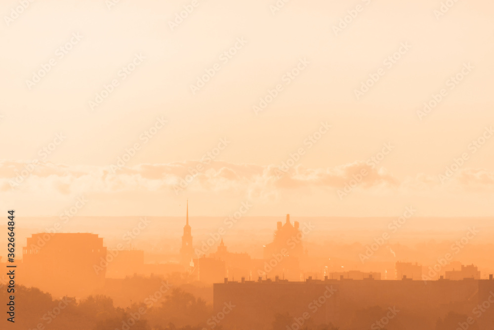 Beautiful orange sunset over the city of Ryazan in summer. Ryazan Kremlin at sunset. Orthodox Church in the sunset