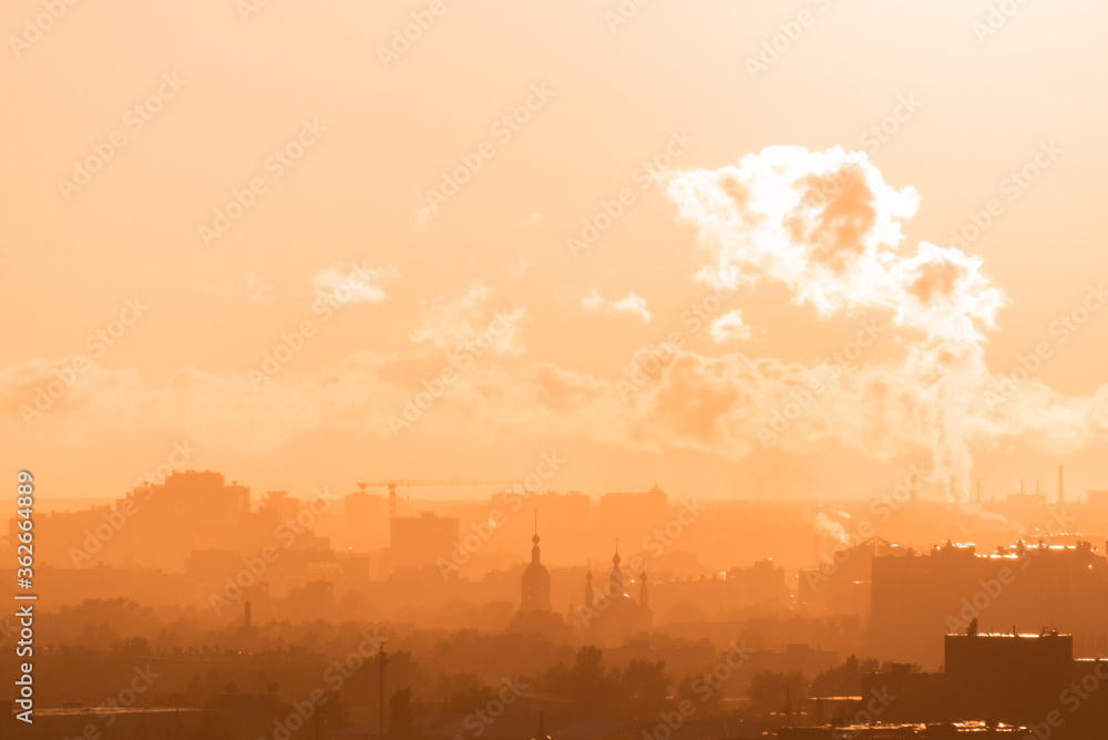 Beautiful orange sunset over the city of Ryazan in summer. Orthodox Church in the sunset