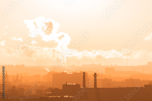 Obraz na płótnie Beautiful orange sunset over the city of Ryazan in summer. Far away smoke from the factory in the rays of sunset w salonie