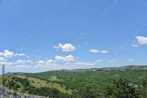 on a high mountain you can see the entire beach and coast during the day in summer