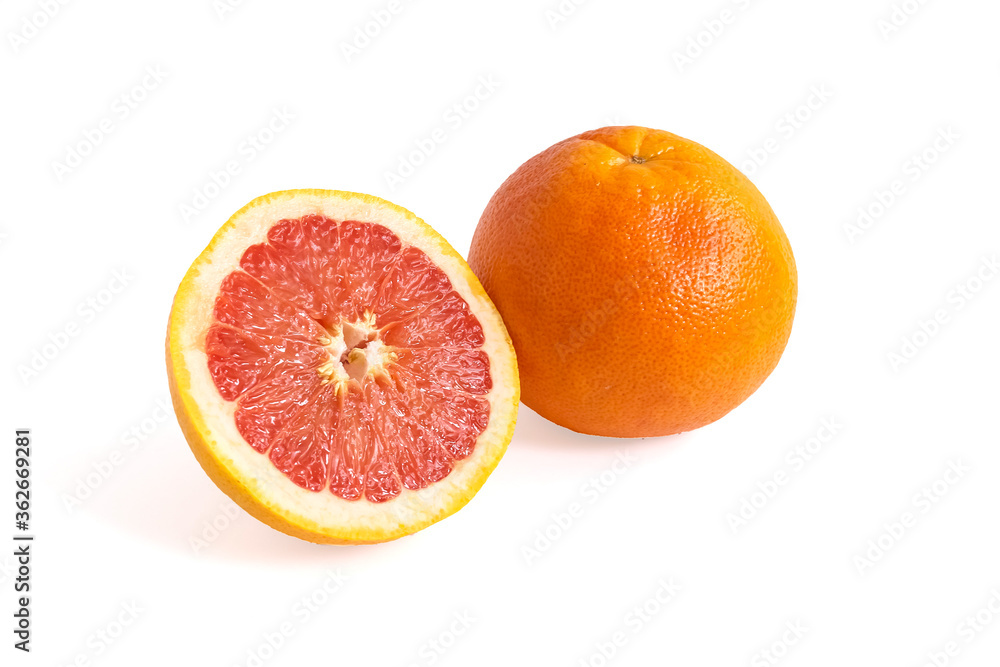Ripe red whole and sliced grapefruit on white background. Minimal fruit concept. Ripe red whole and sliced grapefruit on white background. Minimal fruit concept.