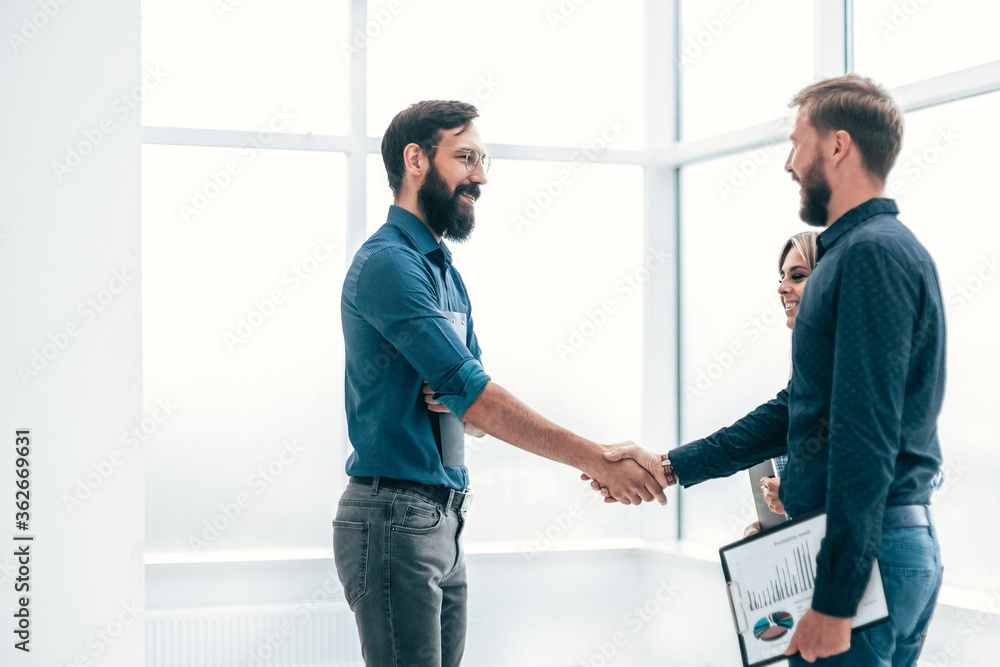 young entrepreneurs shaking hands with each other young entrepreneurs shaking hands with each other