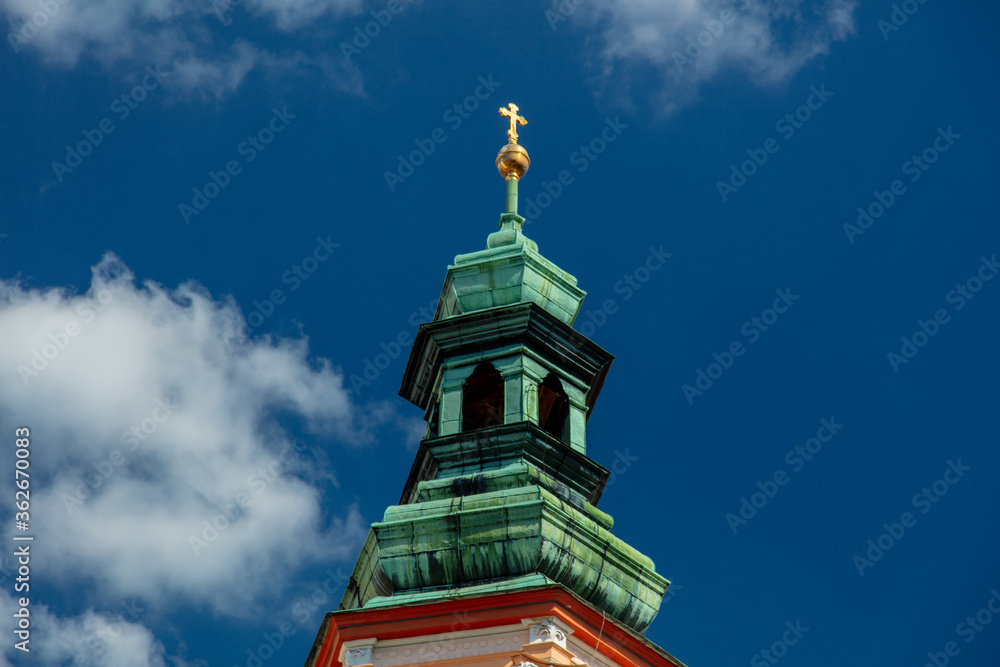 View at abbey and monastery tower with cross in Henrykow, Poland