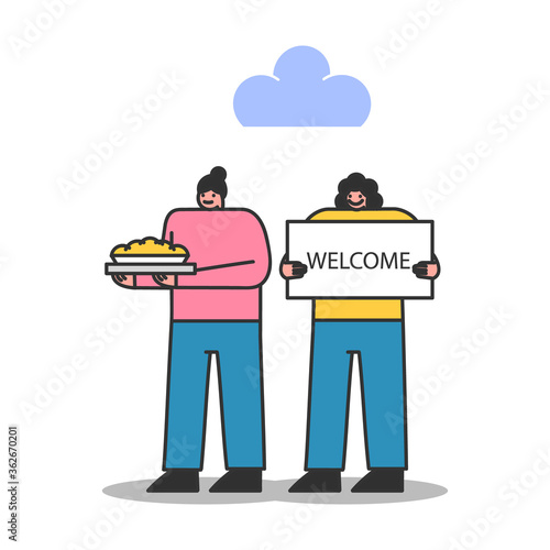 Neighbors welcome newcomers with poster and pie. Two women greeting new neighbors