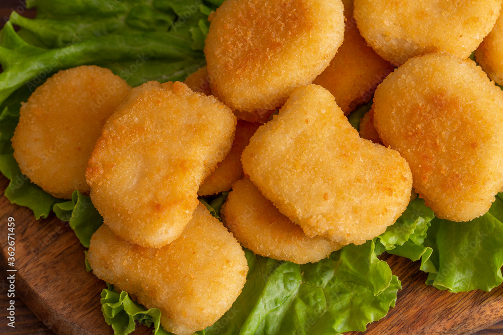 Tasty crispy fried chicken nuggets close-up. View from above. Tasty crispy fried chicken nuggets close-up. View from above.