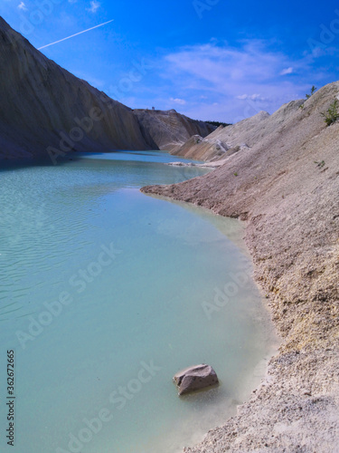 Beautiful summer landscape. Turquoise lake between sand hills. © t.karnash