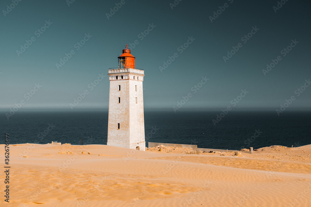 Famous historic light house in the middle of the largest sand dunes in europe. Must seen places during summer vacation. Rubjerg, Knude, North Sea, North Jutland, Denmark, Scandinavia in Europe