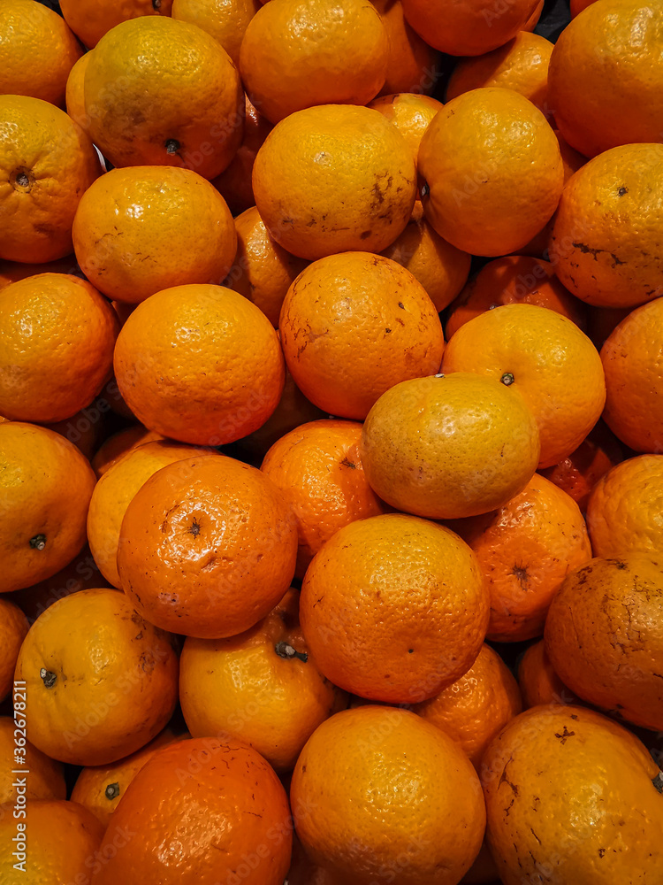 A group of Mandarin oranges on the basket at supermarket A group of Mandarin oranges on the basket at supermarket