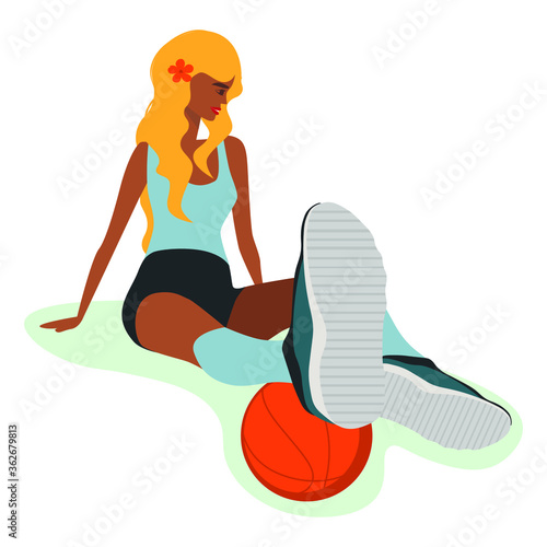 Beautiful girl blonde sits resting after playing sports and playing basketball ball Valeball