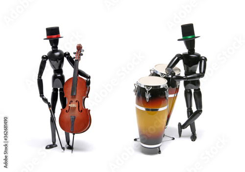 Two black wooden Artist's Figure as musicians isolated on white.Studio shot © Luciano