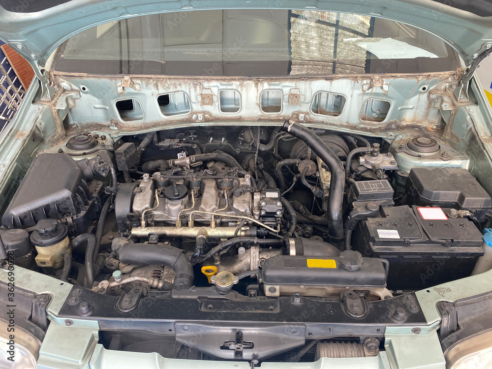 Car in mechanical workshop, front view of the engine. Lifestyle concept. Car in mechanical workshop, front view of the engine. Lifestyle concept.