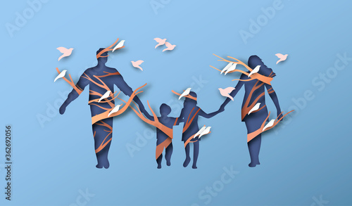 Papercut family holding hands with bird tree