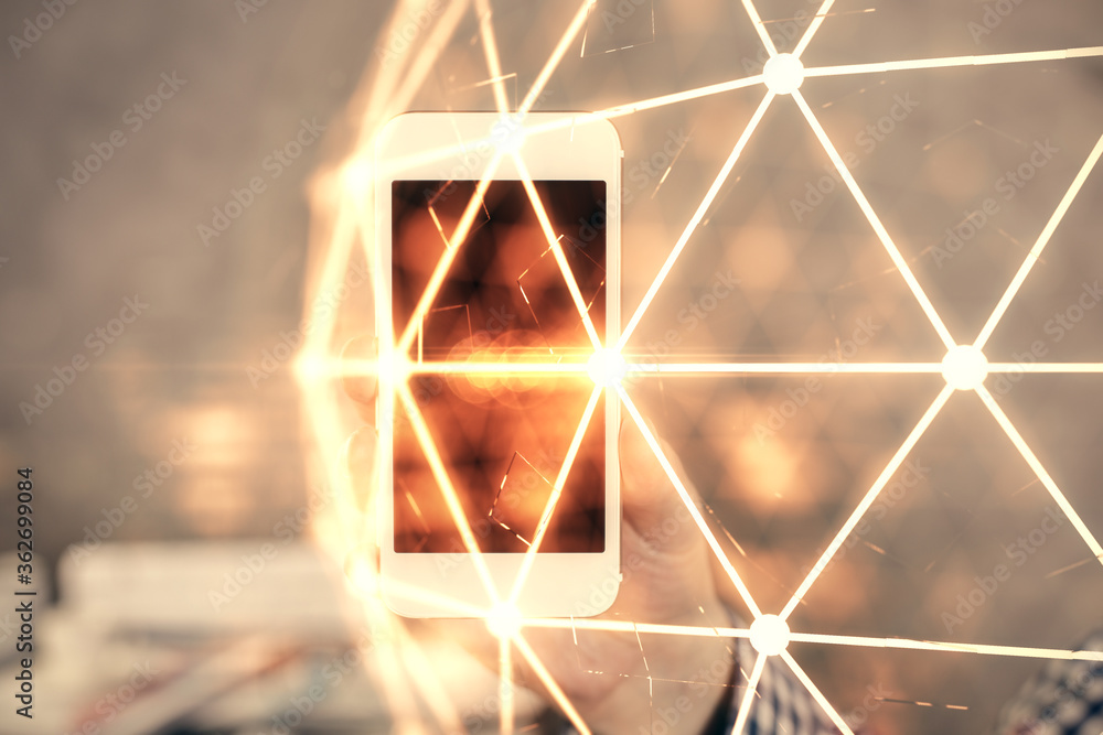 Double exposure of man's hands holding and using a phone and social network theme drawing. Double exposure of man's hands holding and using a phone and social network theme drawing.