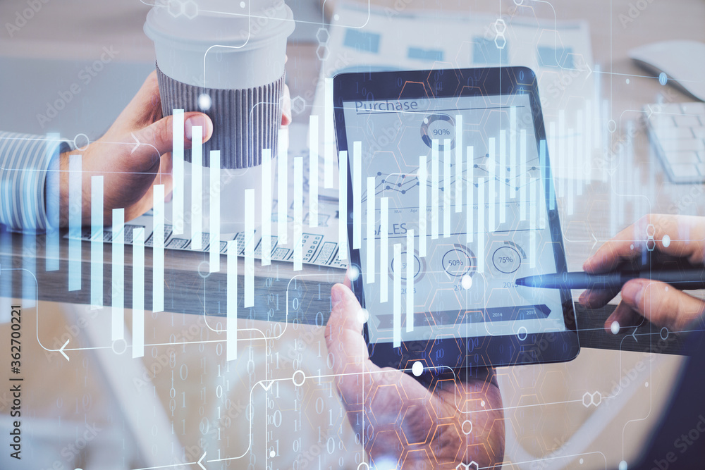 Double exposure of man's hands holding and using a phone and financial chart drawing. Market analysis concept. Double exposure of man's hands holding and using a phone and financial chart drawing. Market analysis concept.