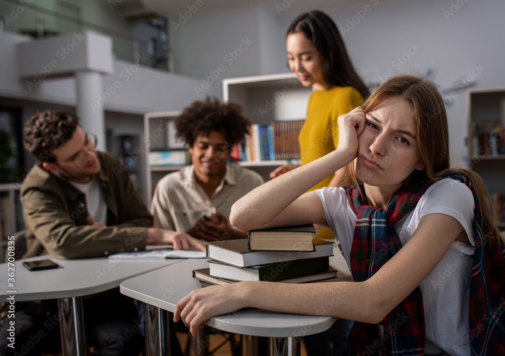 Tired university student has difficulty to study. Concept of stress, question and difficulty Tired university student has difficulty to study. Concept of stress, question and difficulty