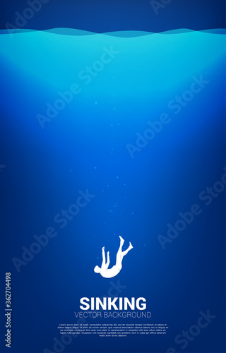 silhouette of businessman sinking down in water. Concept for fail and accidental business