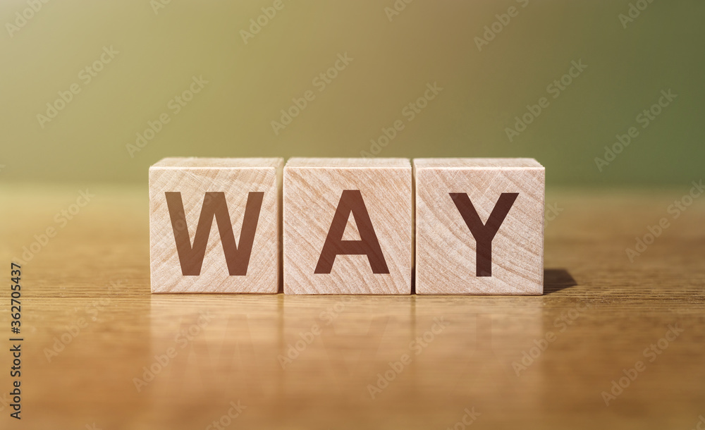 text the word way from wooden cubes on a table text the word way from wooden cubes on a table