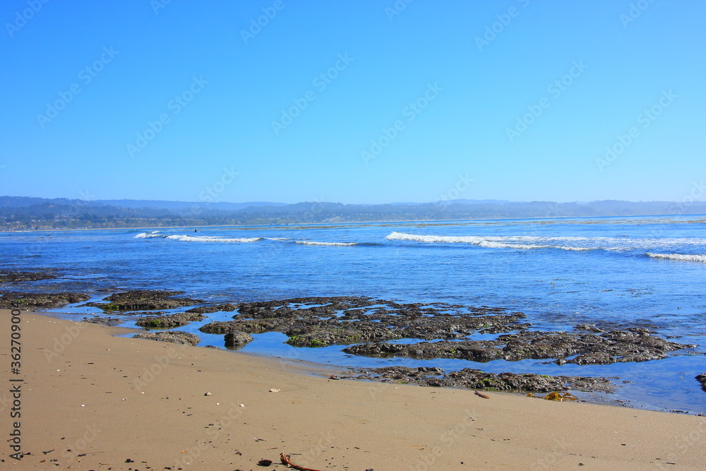 California Pacific Coastal scenery of the ocean low tide with rocks
