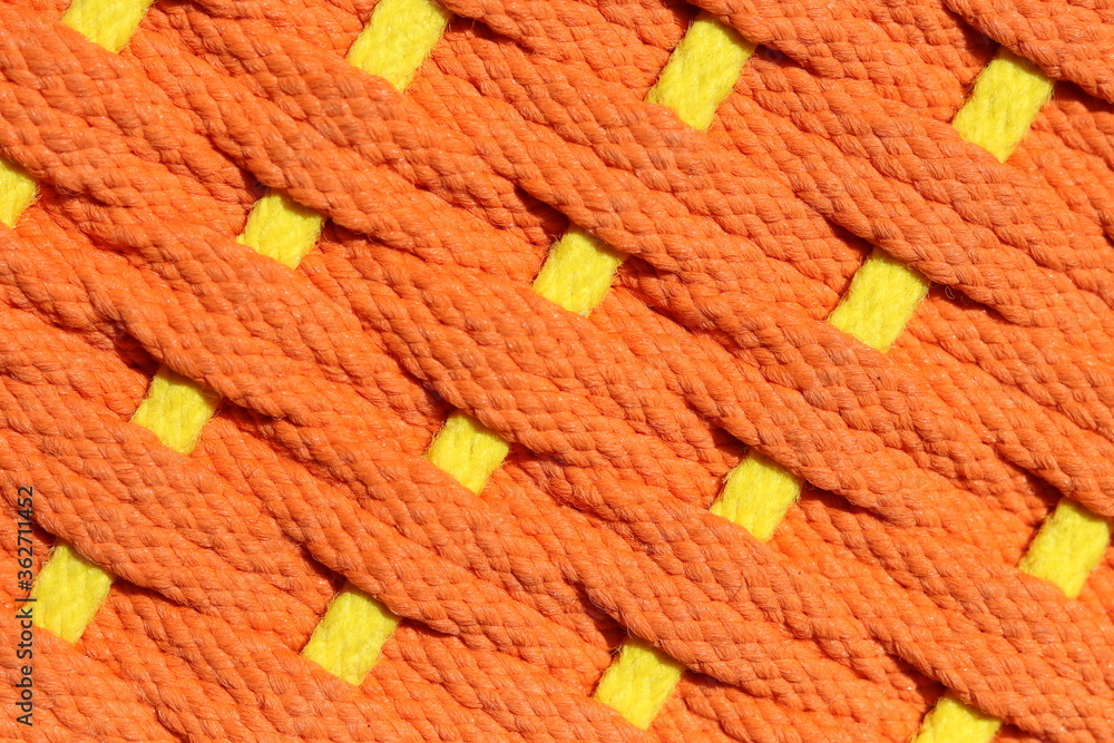 Ropes weave texture in orange color with yellow line cut through