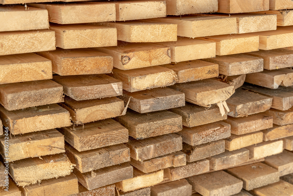 Wooden boards in stack. Construction material. Close-up Wooden boards in stack. Construction material. Close-up