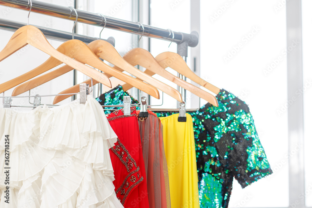 Rental fashion clothes concept. Festive clothes on the rail. Fashion blog, website, social media hero header. Rental fashion clothes concept. Festive clothes on the rail. Fashion blog, website, social media hero header.