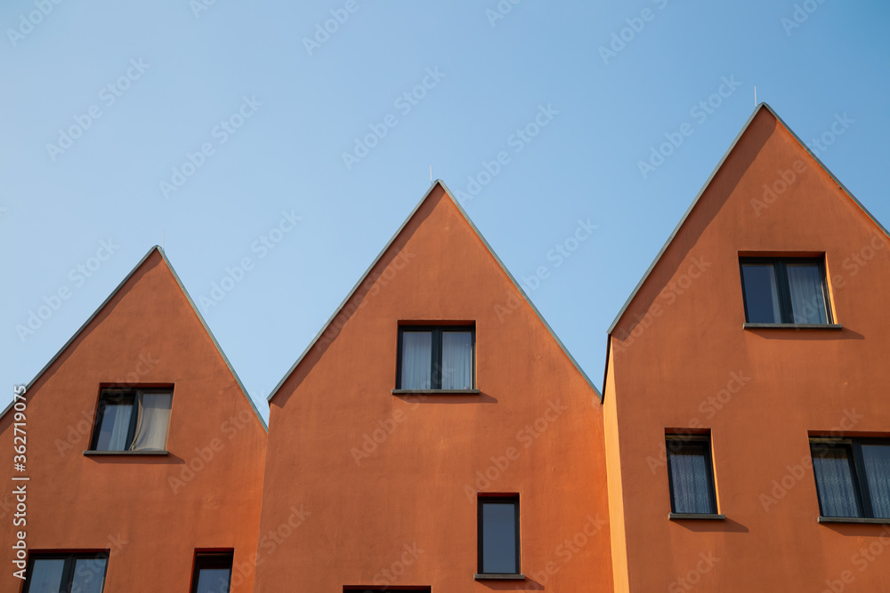 Orange brown apartment residential building under blue sky in Frankfurt, Germany Orange brown apartment residential building under blue sky in Frankfurt, Germany
