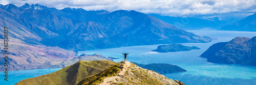 Roys peak mountain hike in Wanaka New Zealand. Popular tourism travel destination. Concept for hiking travel and adventure. New Zealand landscape background. 