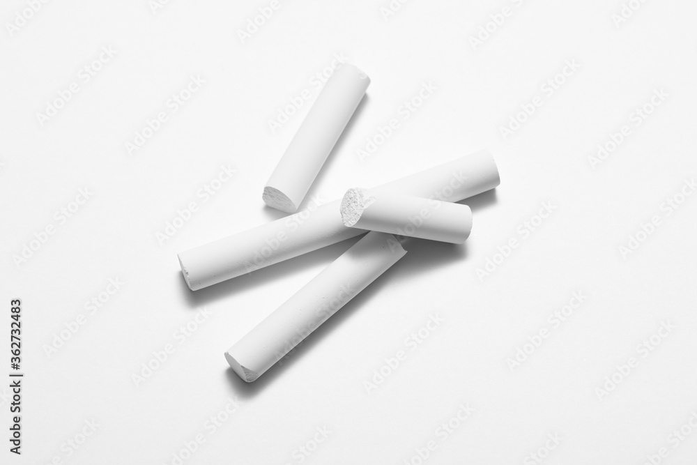 Naklejka premium White chalk isolated on a white background