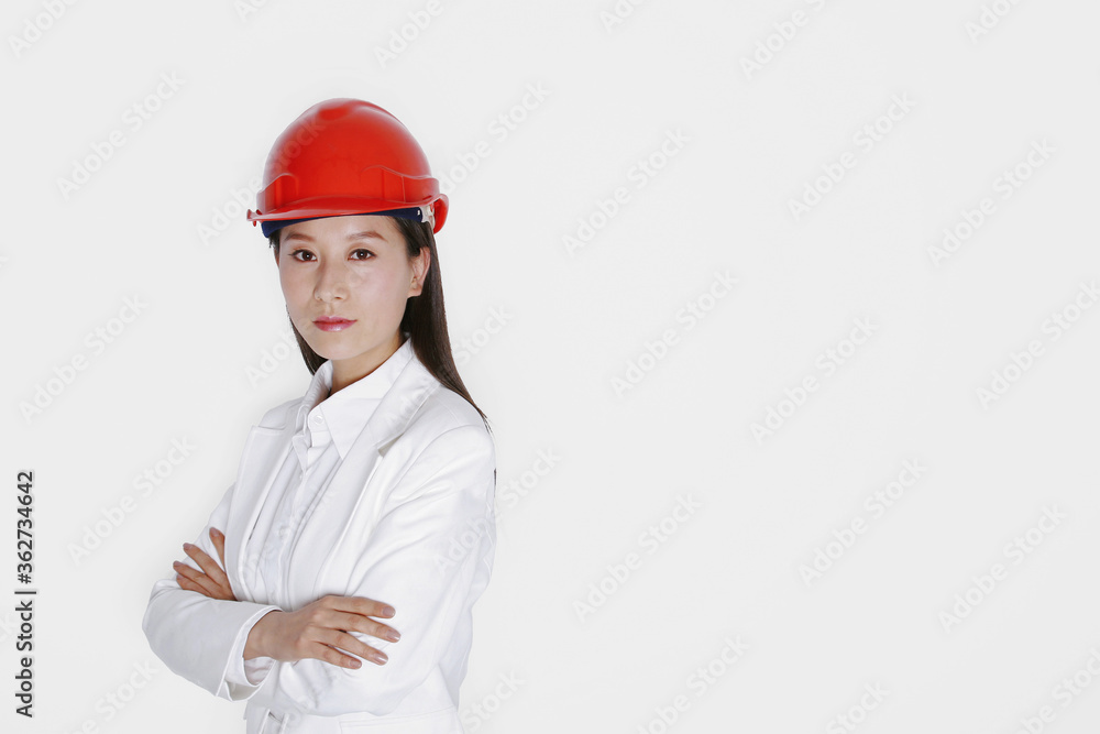 Businesswoman wearing safety helmet Businesswoman wearing safety helmet