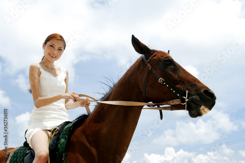 Woman riding a horse