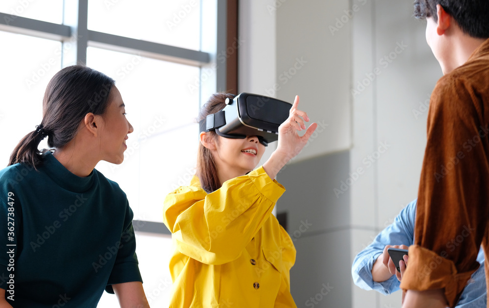 VR mobile phone application test, Asian woman with virtual reality glasses  headset in VR experience, Asia business team developers for reality  simulator smartphone app test, ui Stock Photo | Adobe Stock