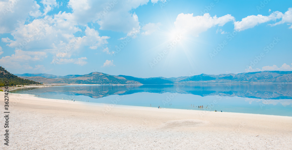 Holidaymakers sunbathing at Salda white beach - Salda Lake, Burdur - Turkey