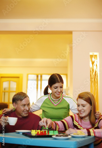 Family playing board game at home