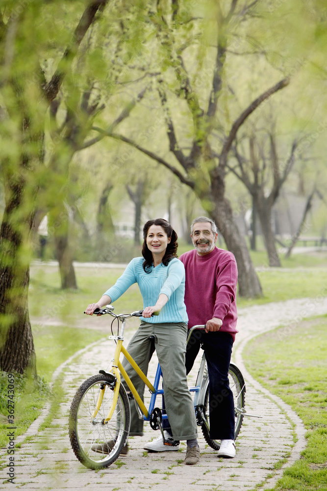Couple cycling in the park