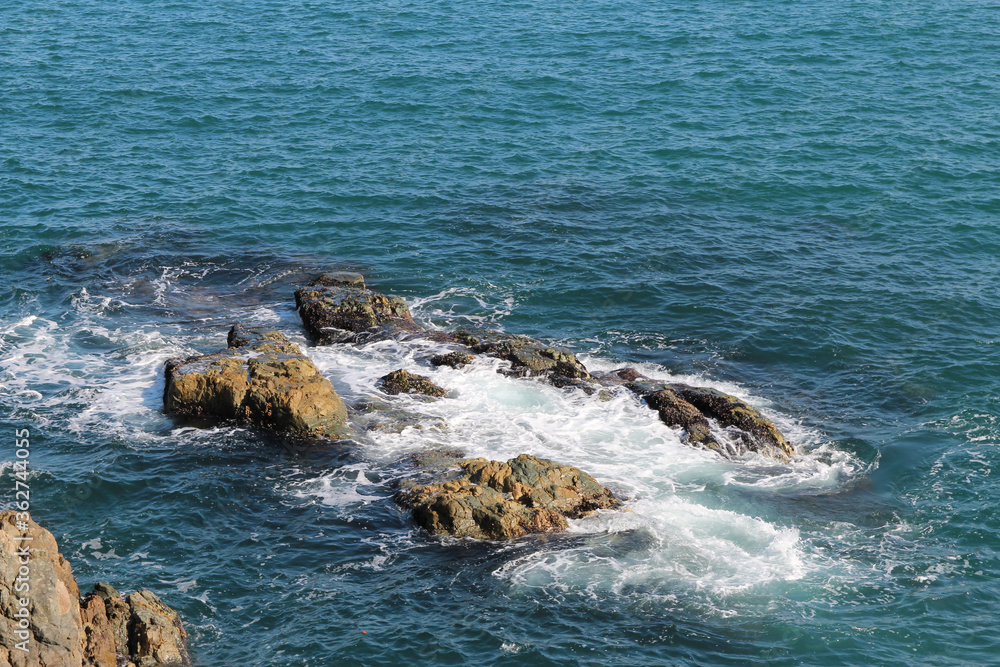 Splashes of wave around the rocks at Orkyukdo Island, South Korea Splashes of wave around the rocks at Orkyukdo Island, South Korea