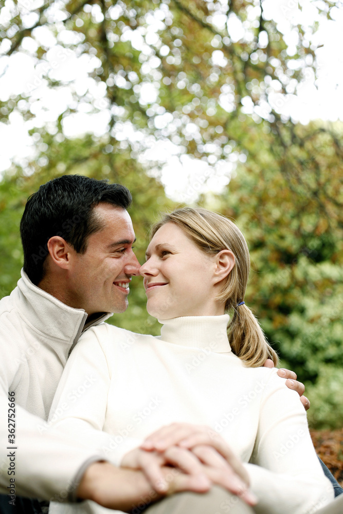 Couple smiling while looking at each other