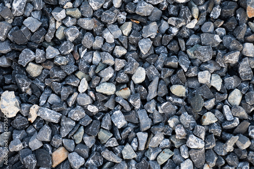Top view of blue construction gravel texture background. Small granite stone full frame background.