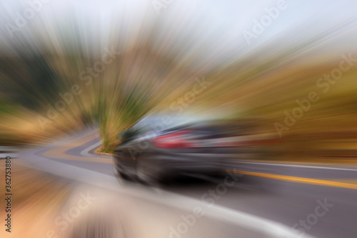 Car on asphalt road with motion background.