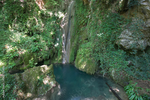 Fantastic view of wild waterfall with lake in the forest near Castel di Fiori, Terni, Umbria, Italy photo