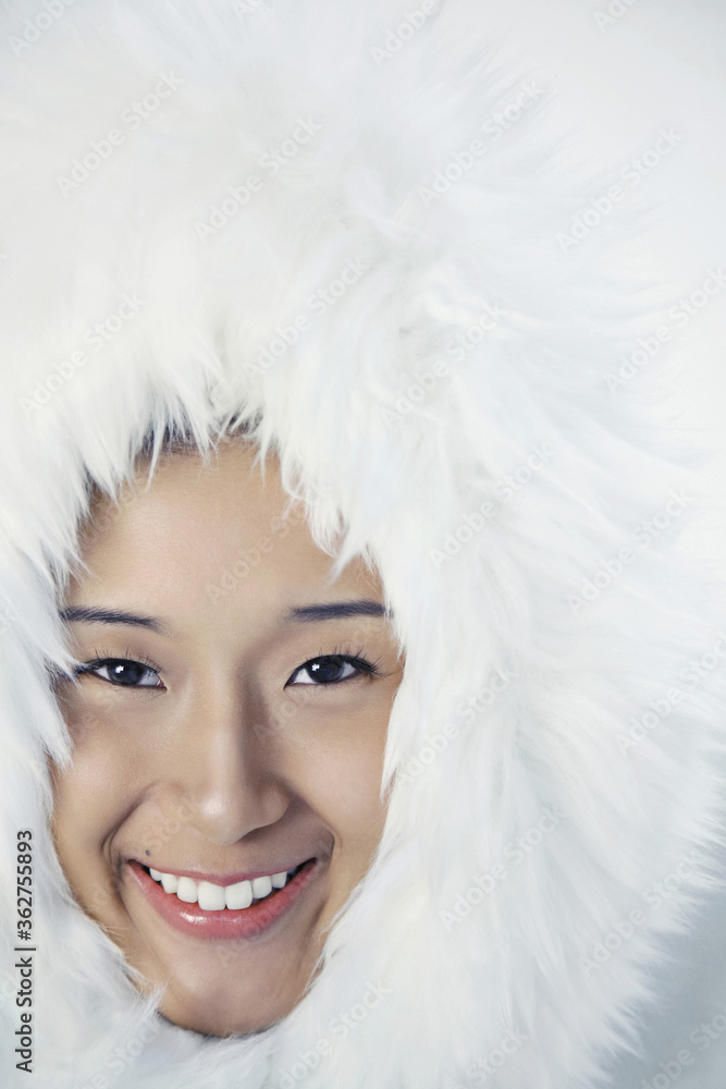 Woman in white furry jacket