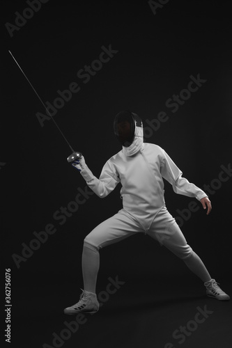 Man holding fencing foil