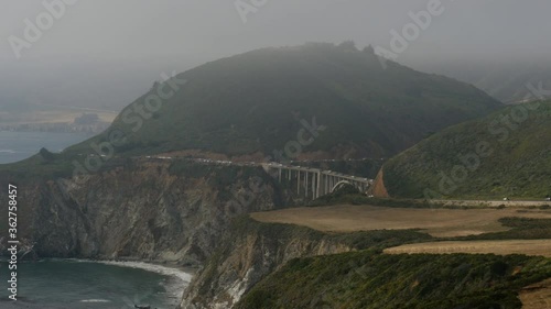 Bixby Creek Bridge from a distance wide shot at Big Sur Coastline California USA shot in 4k high resolution